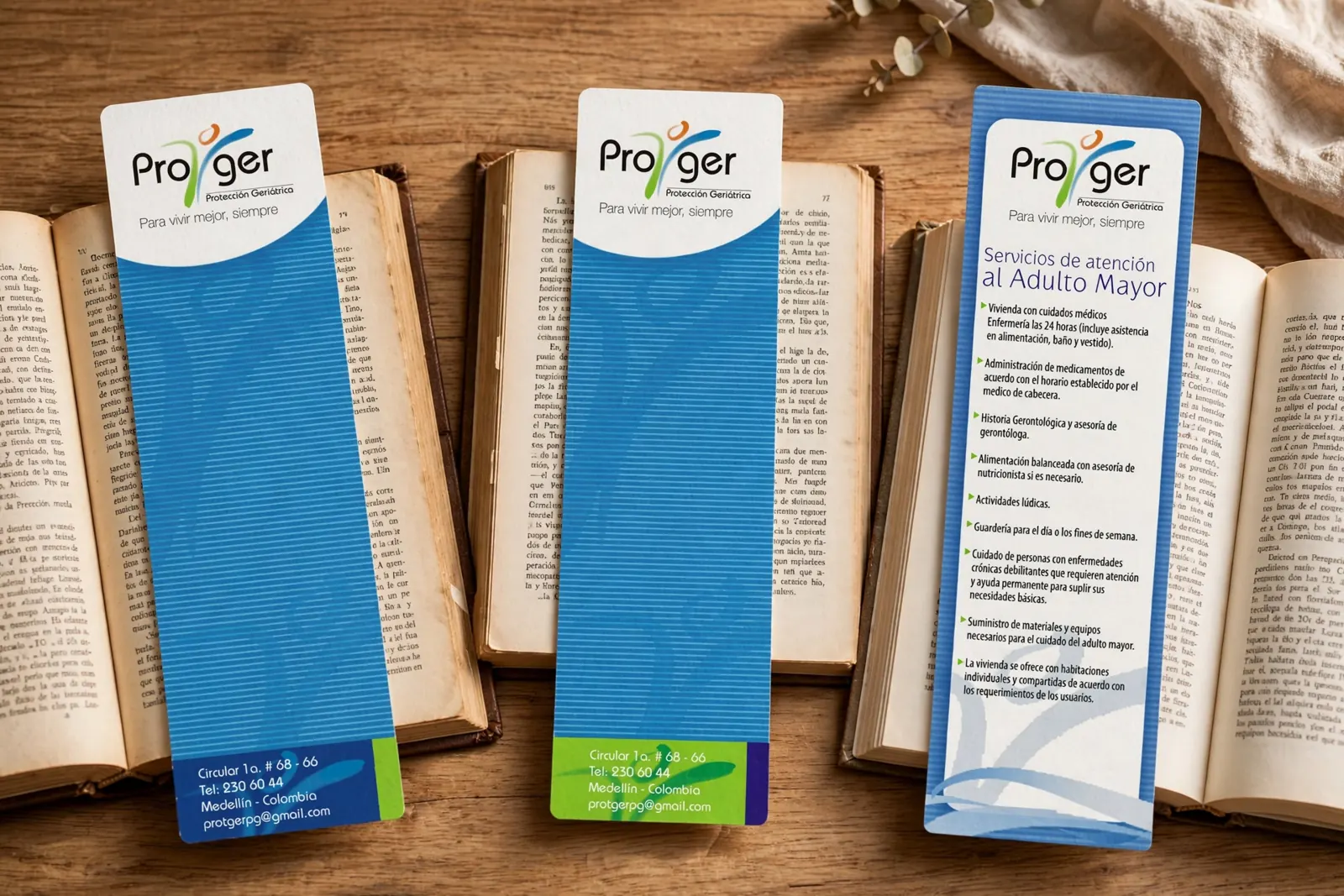 Separadores de libros impresos con identidad gráfica en azul y verde